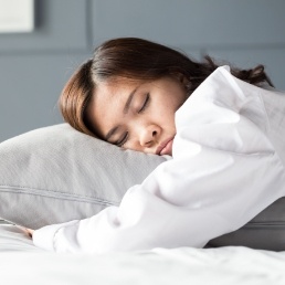 Woman resting thanks to sleep apnea treatment