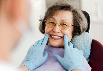 Dentist examining patient's smile