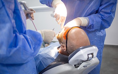 Patient in Warsaw getting dental implant surgery