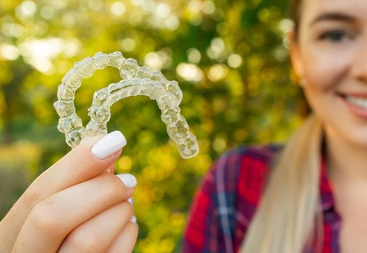 Lady shows off her clear aligners